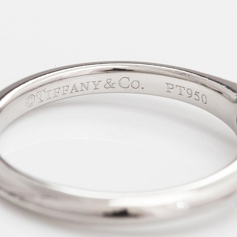 Tiffany & Co, A platinum ring with a ca. 0.26 ct diamond.