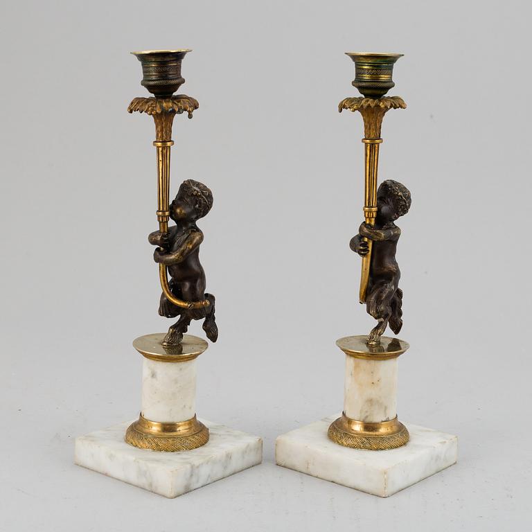A pair of gustavian style candles sticks, circa 1900.