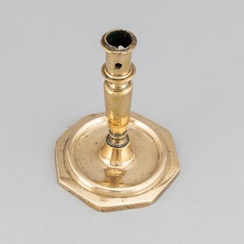 A 17th century bronze candlestick.