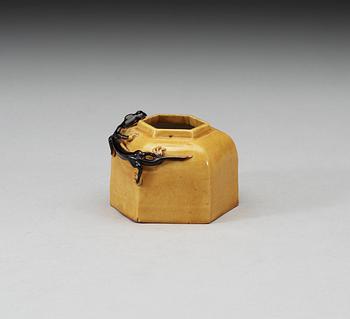 A yellow and brown glazed brush washer with curling dragon, Qing dynasty, 19th Century, with Xuande four character mark.