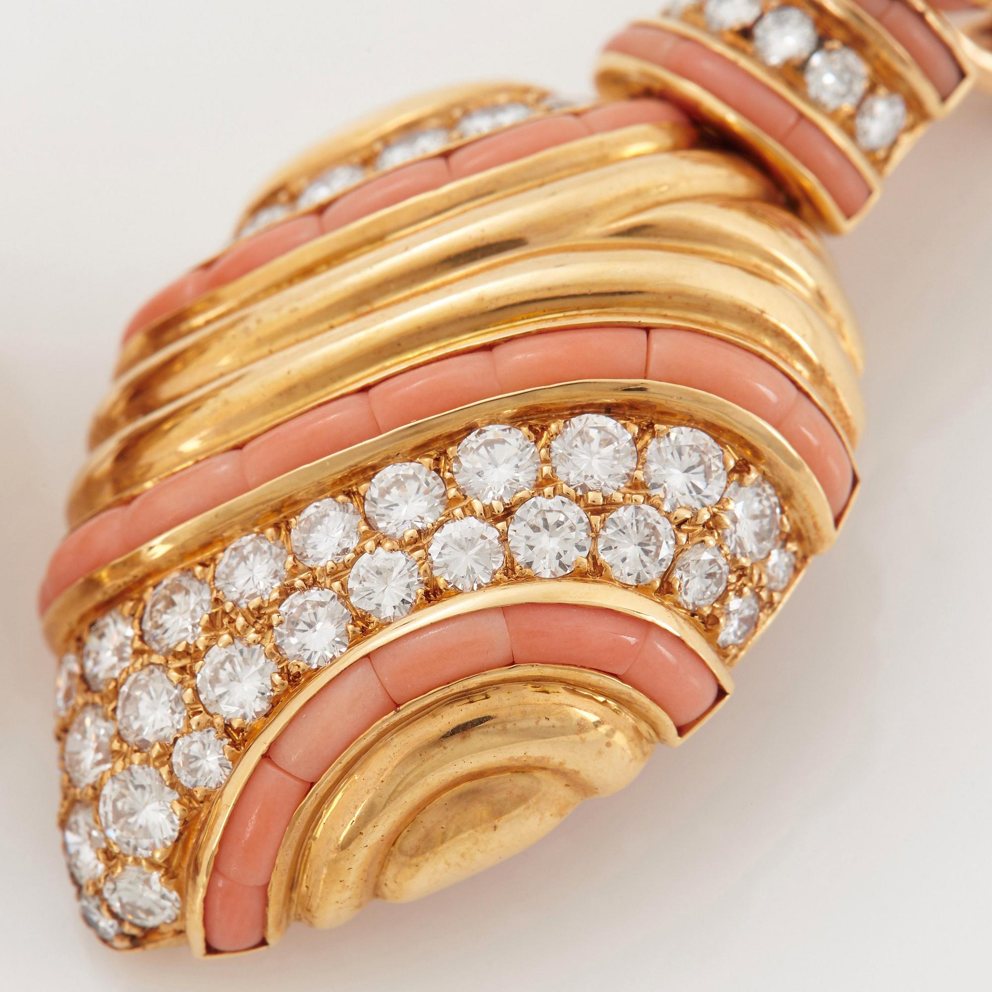 A pair of 18K gold Boucheron earrings set with round brilliant-cut diamonds and coral.