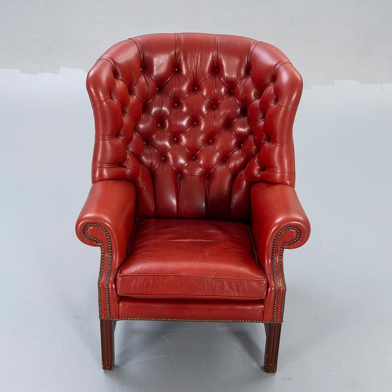 An English leather wing back chair later part of the 20th century.