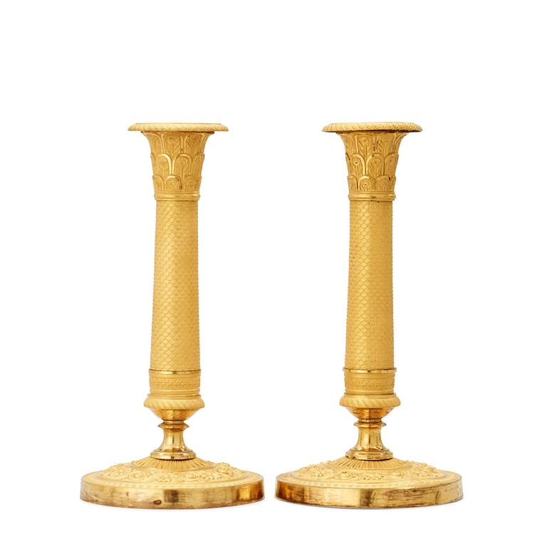 A pair of French Empire 19th century candlesticks.