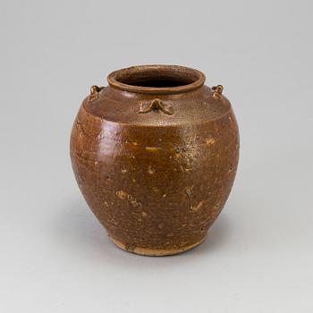 A south east asian pottery urn 18/19th century.