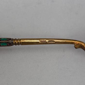 A Russian early 20th century set of ten silver-gilt and enamel tea-spoons, unidentified makers mark, Moscow 1899-1908.