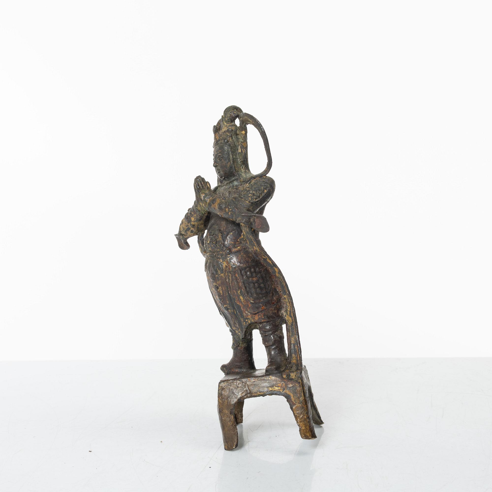 A Chinese bronze figure of a guardsman, Ming dynasty (1368-1644).