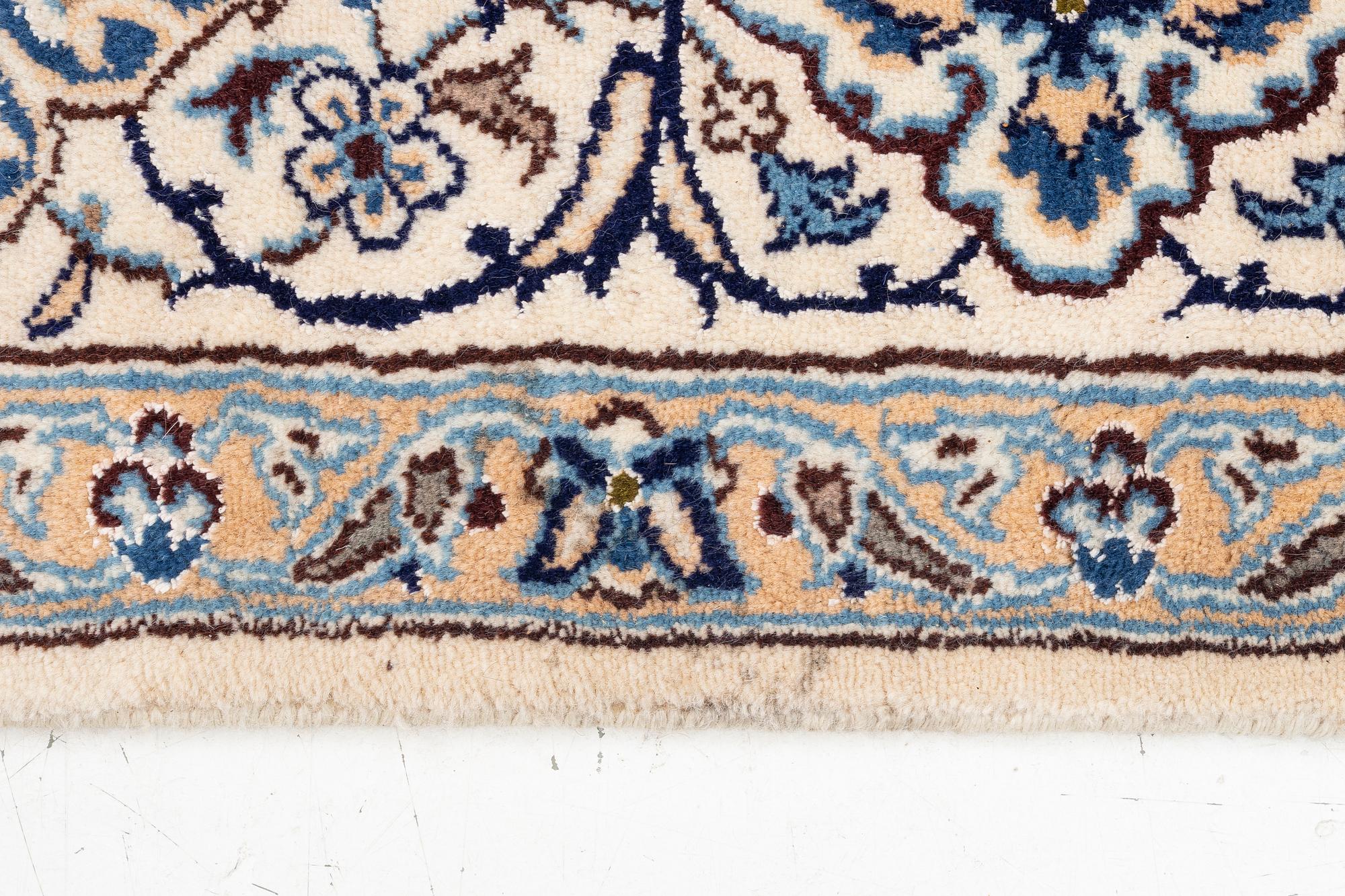 An oriental carpet, c. 310 x 200 cm.