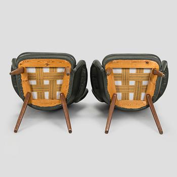 A pair of mid-20th century armchairs.