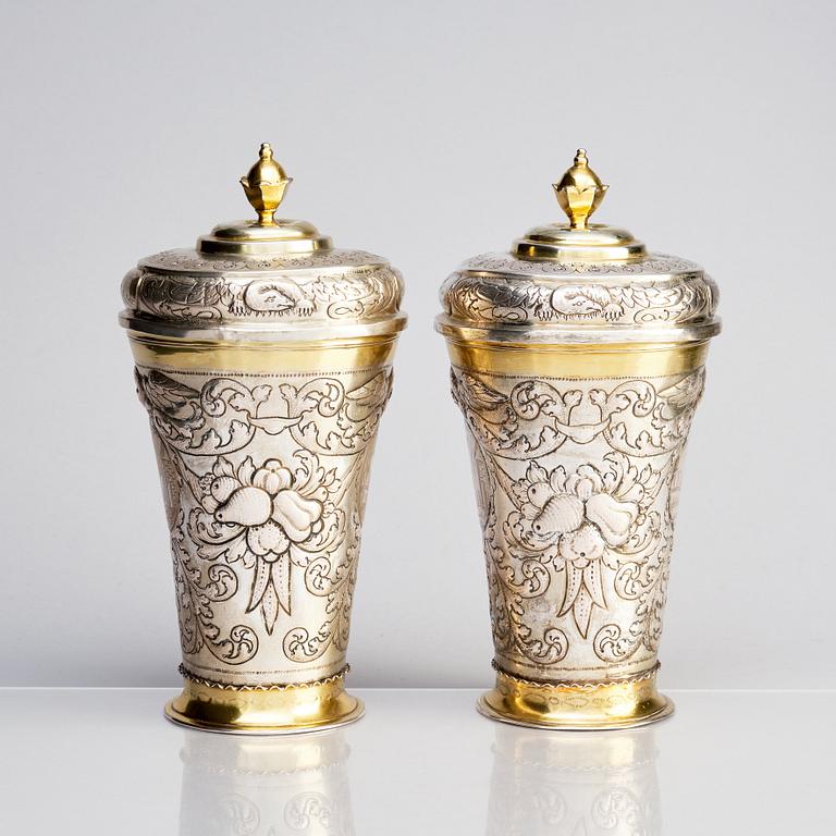 A pair of Russian Baroque parcel-gilt silver cups and covers, mark of Nikifor Timofeev, Moscow 1729.