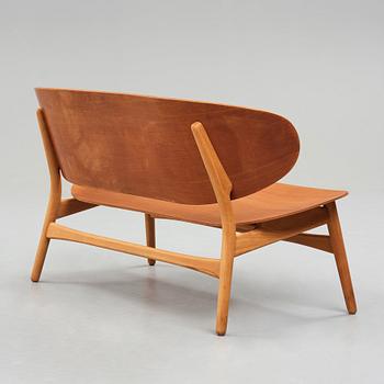 A HANS J WEGNER, a  "Shell set/ Skalsæt" comprising a sofa, a chair and a table, Fritz Hansen, Denmark 1950's.