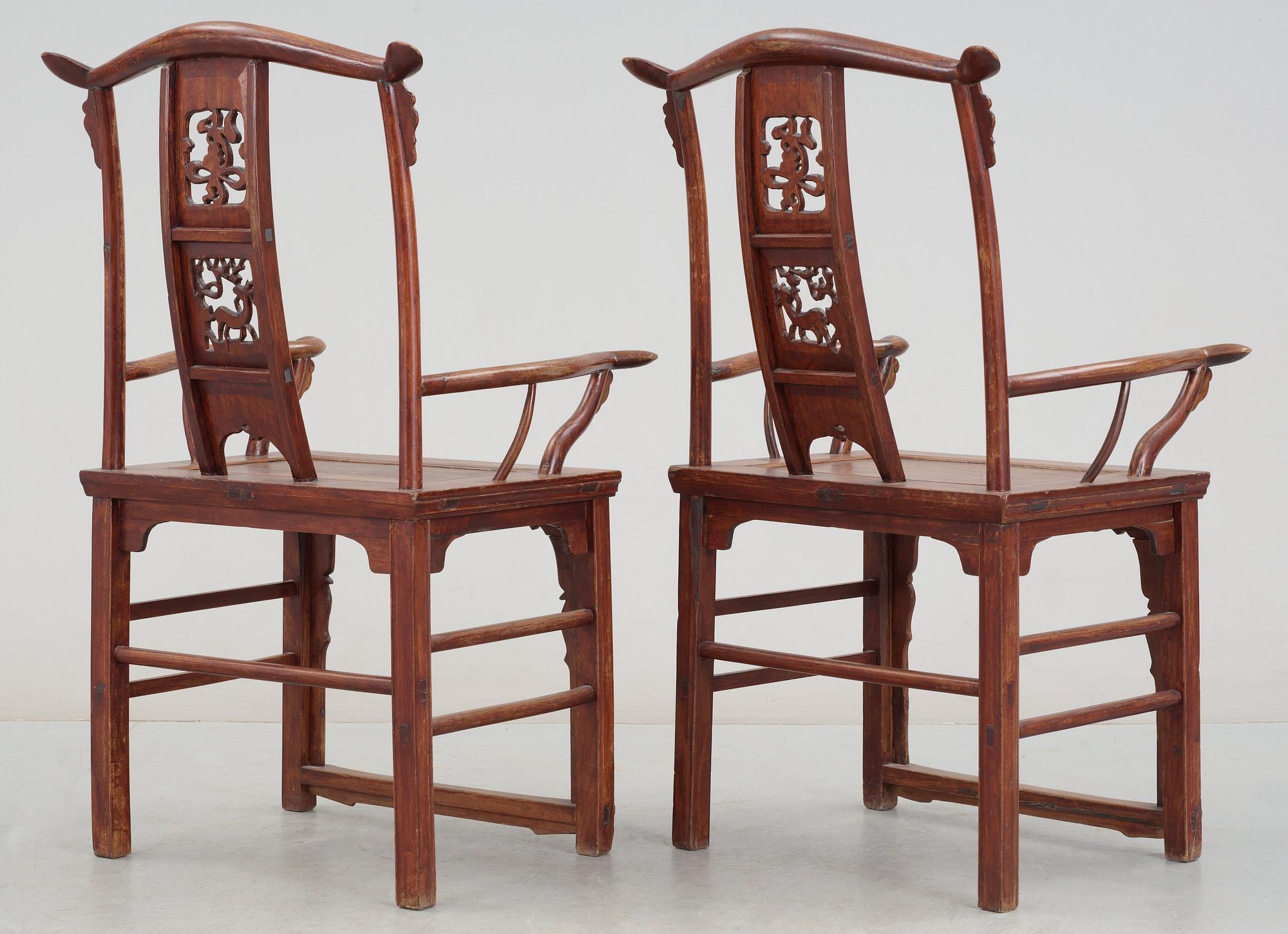 A pair of hardwood armchairs, late Qing dynasty (1644-1912).