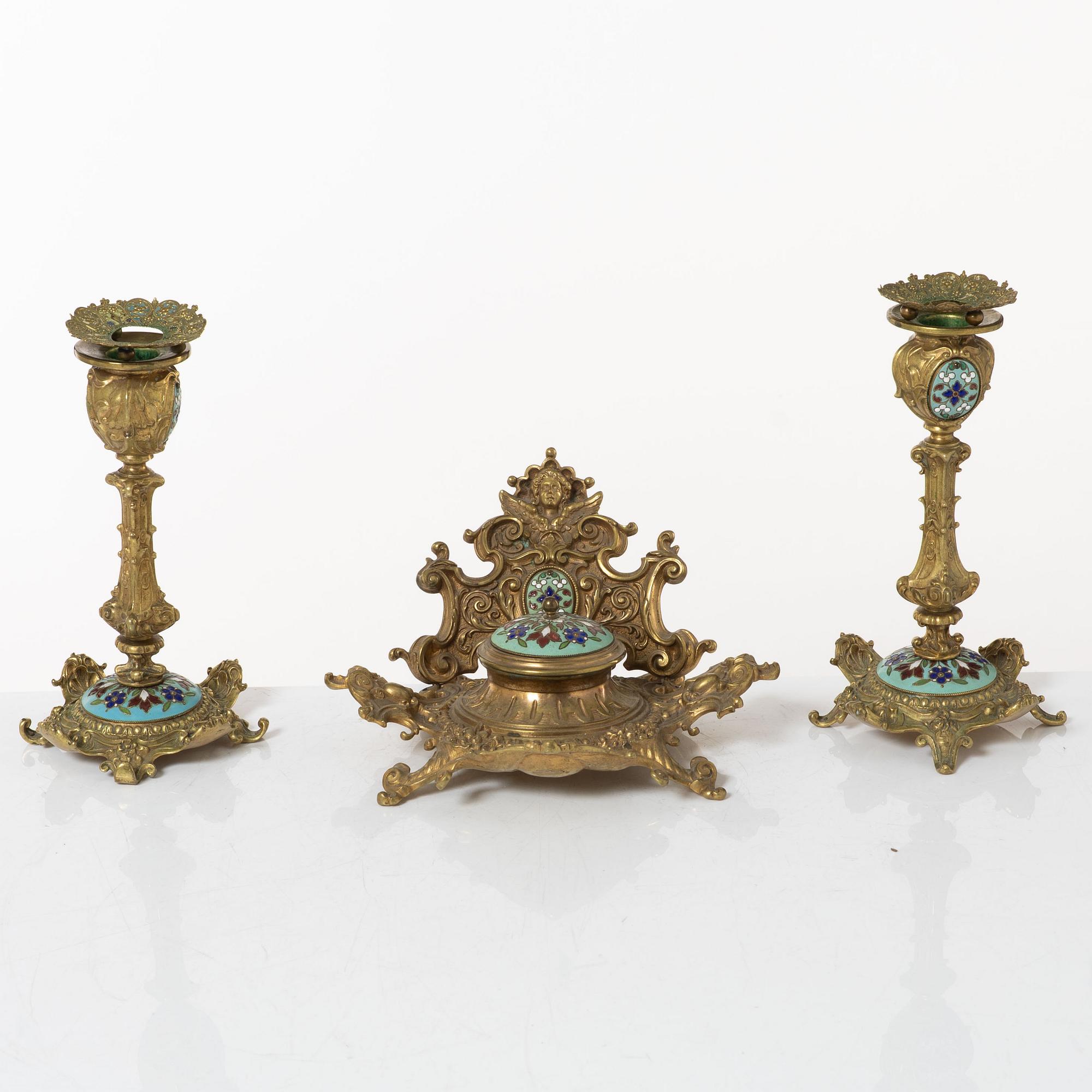A pair candlesticks and an inkwell, circa 1900.