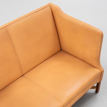 Kaare Klint, a leather upholstered model 4118 sofa, Rud Rasmusseun, Denmark, 1980's.
