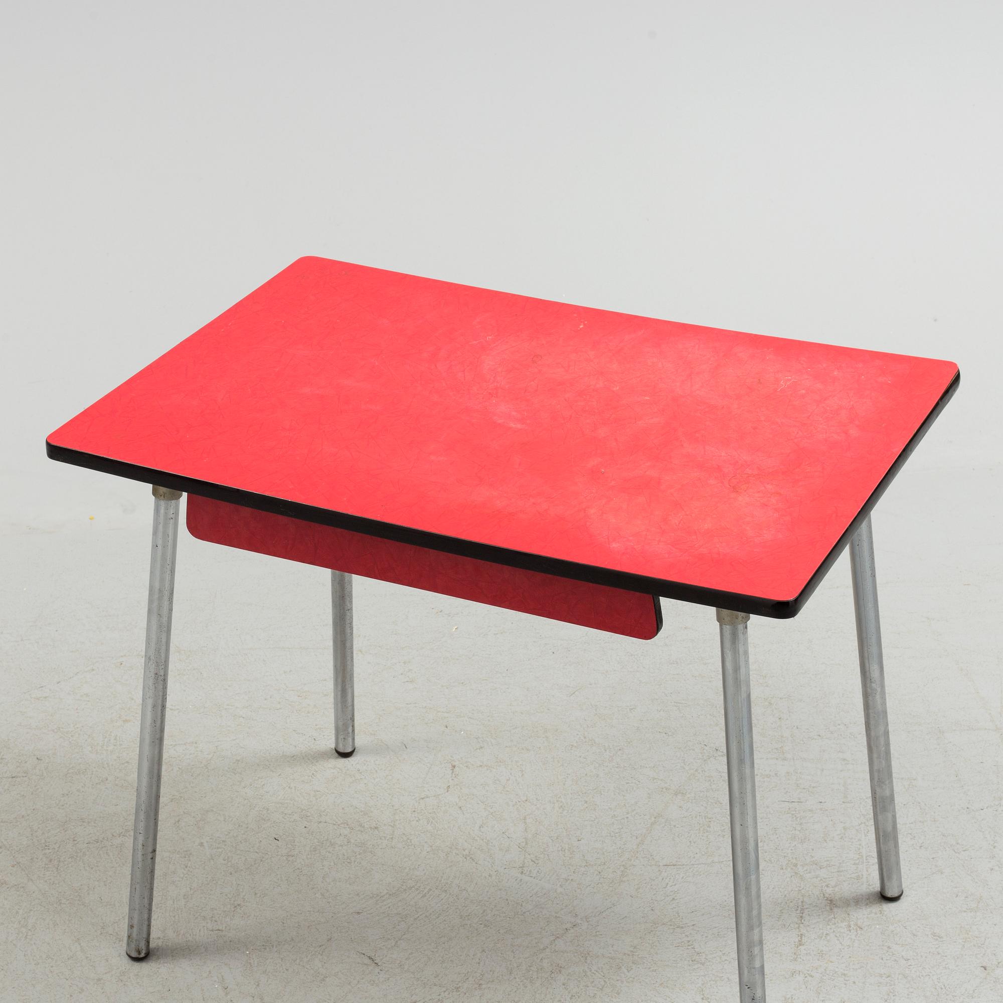 A mid 20th century table and chair.