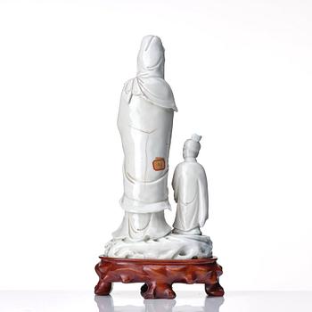 A blanc de chine figure of Guanyin and a servant, Qing dynasty, 19th Century.