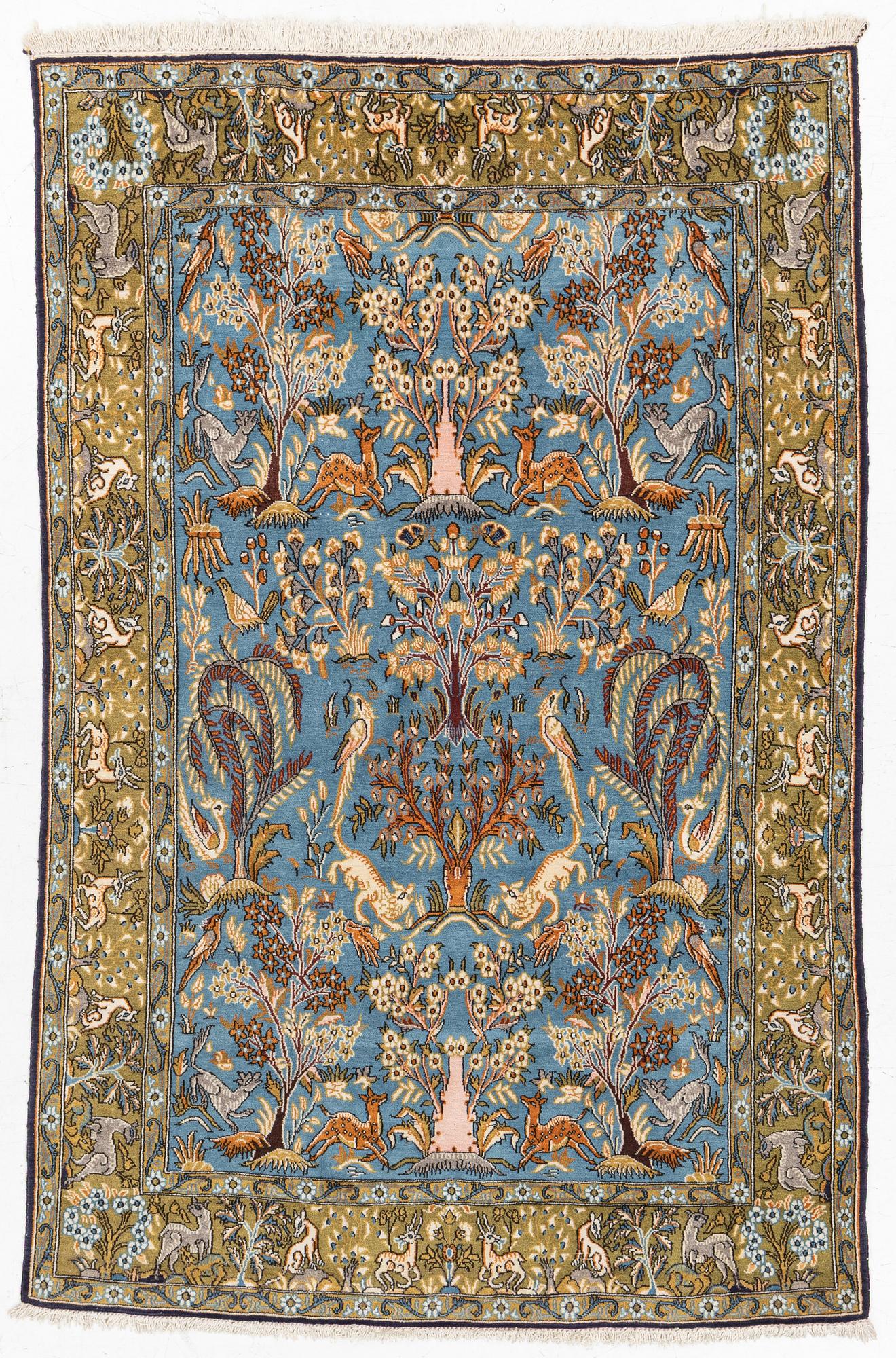A Ghom figural rug, c. 202 x 132 cm.