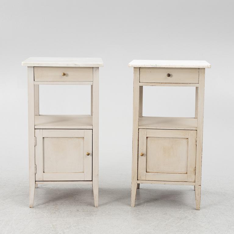 A matched pair of bedside tables.