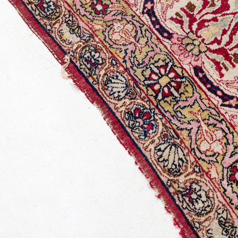 An antique Kerman Laver carpet, south east persia, ca 501 x 359 cm.