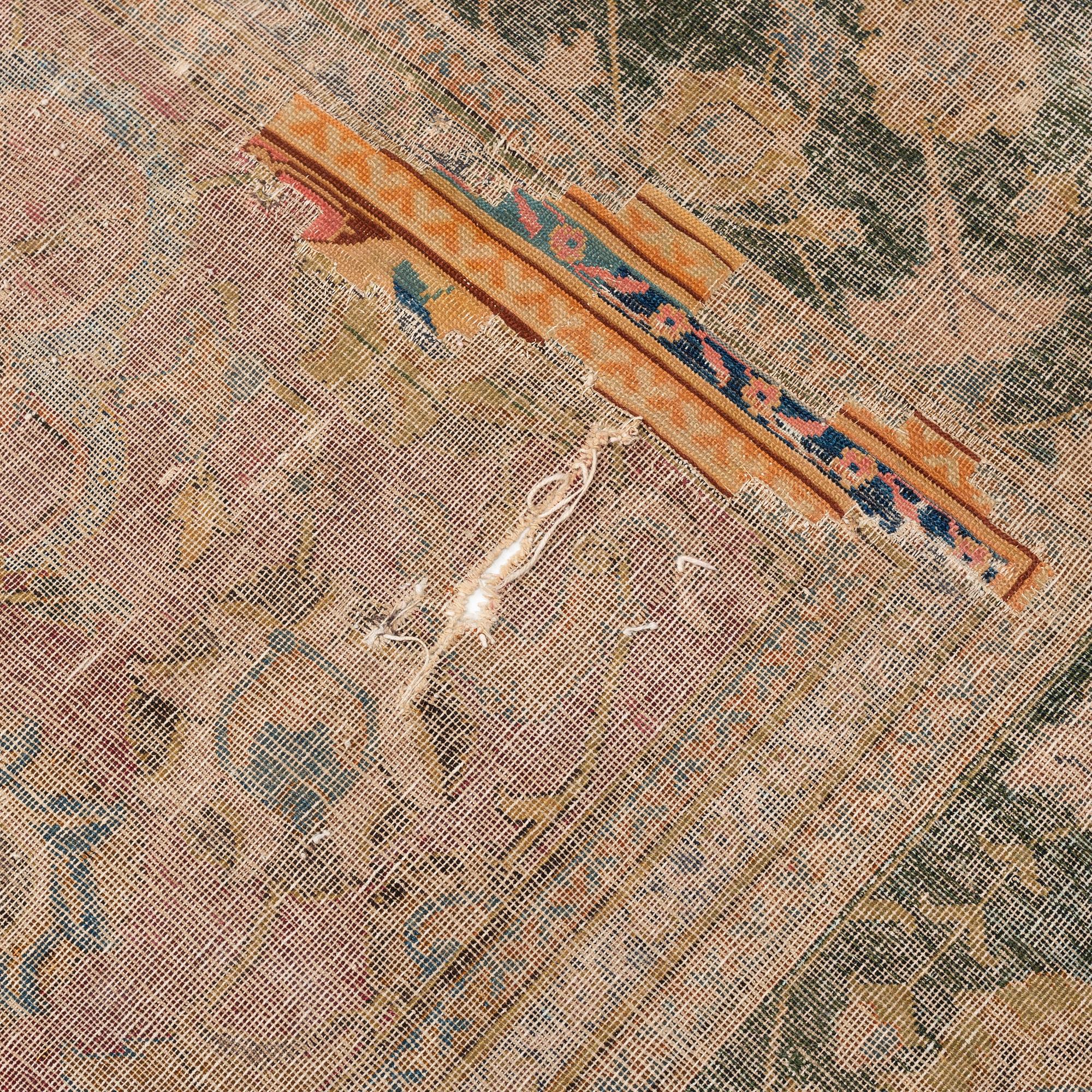 A safavid 'Spiral vine' Esfahan carpet, central persia, mid to second haft of the 17th century. Ca 562 x 231 cm.