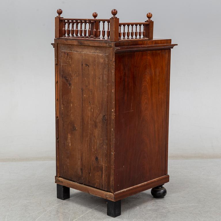 A Swedish Empire cupboard, first half of the 19th century.