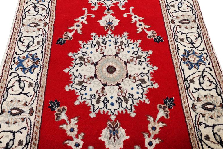 A runner carpet, Nain, part silk, 9 laa, c. 378 x 84 cm.