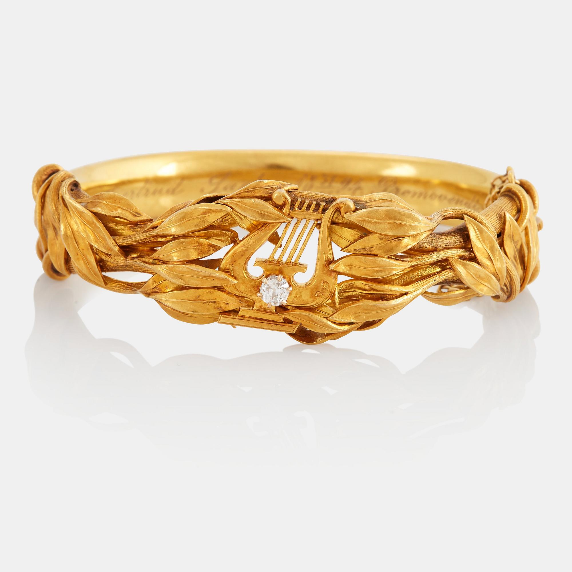 Armring 18K guld med en gammalslipad diamant.