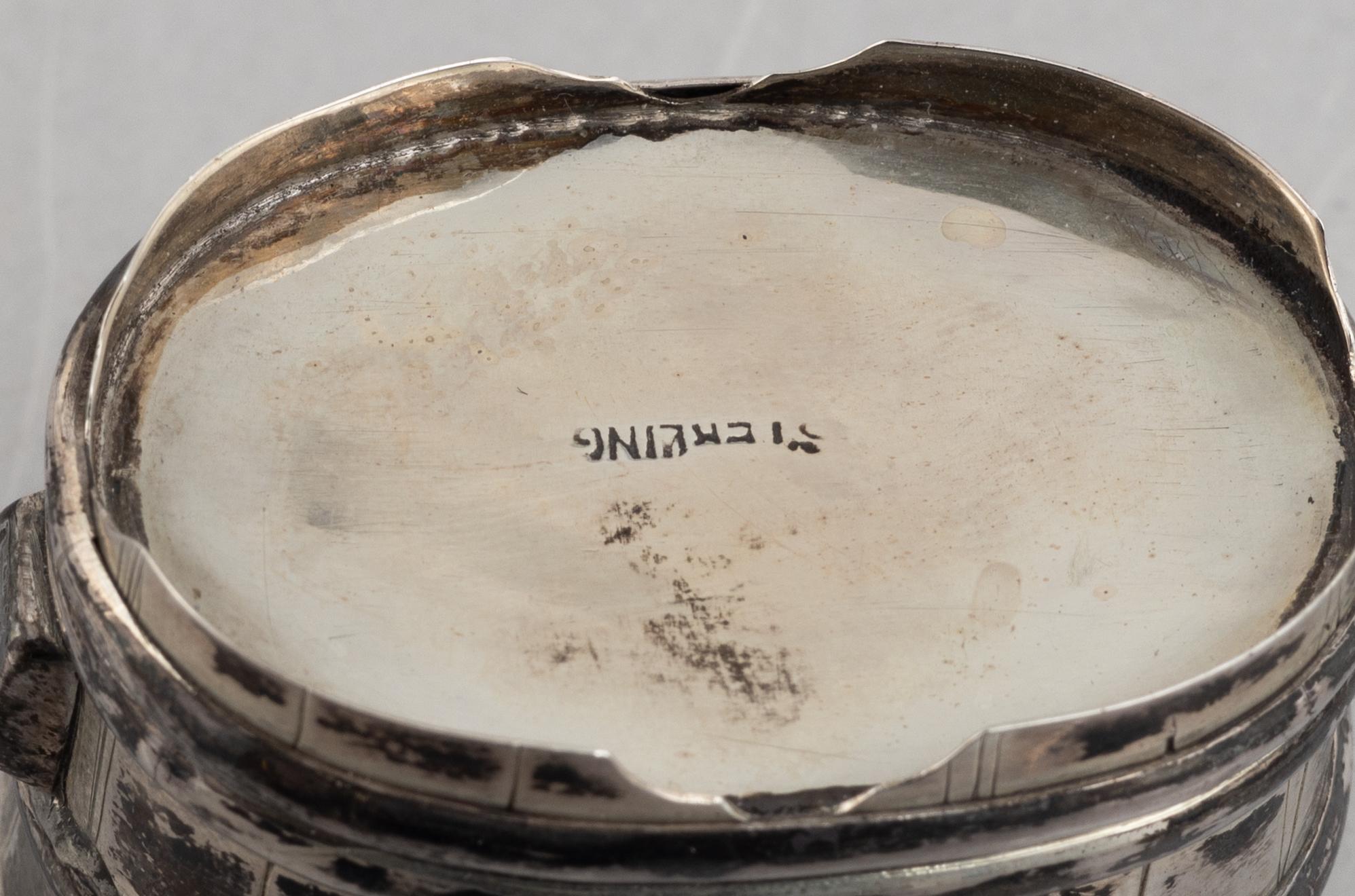 A set of three Japanese silver coasters and a pair of salts with shakers, 20th century.