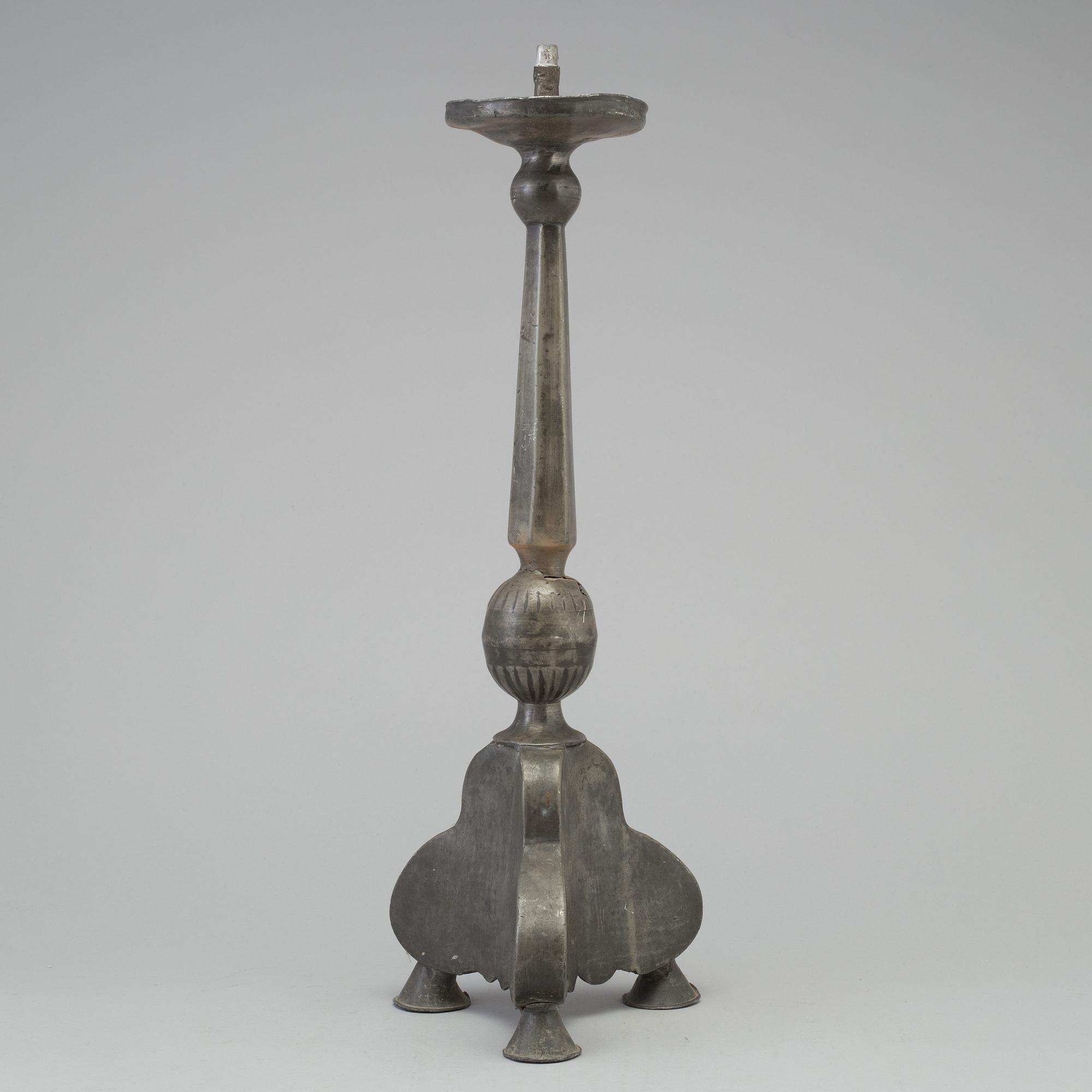 A 17th century pewter candlestick.