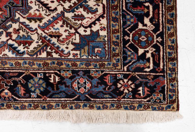 A Heris carpet, approx. 275 x 200 cm.