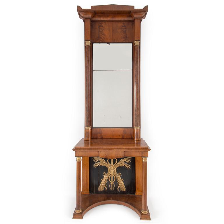 A swedish empire mirror and console table. First half of the 19th century.