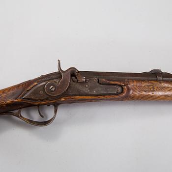 A percussion rifle marked Tula 1788.