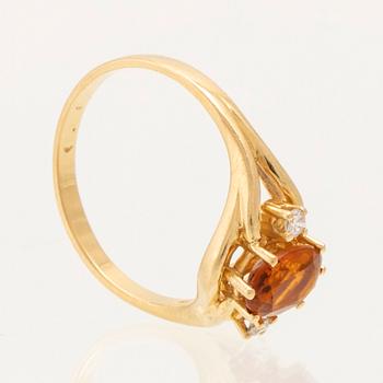 H.Stern ring in 18K gold with an oval faceted citrine and round brilliant-cut diamonds.