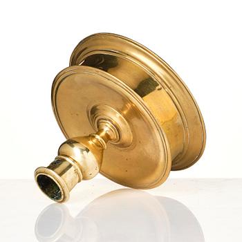 A Northern European baroque brass candlesticsk, late 17th century.