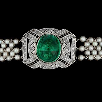 A cabochon cut emerald, rose cut diamonds and natural pearl bracelet, c. 1915.
