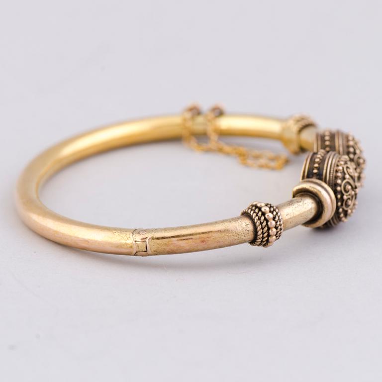 ARMRING, 14K guld.