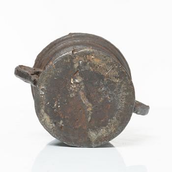 A cast-iron mortar and pestle of renaissance-type, 17th century.