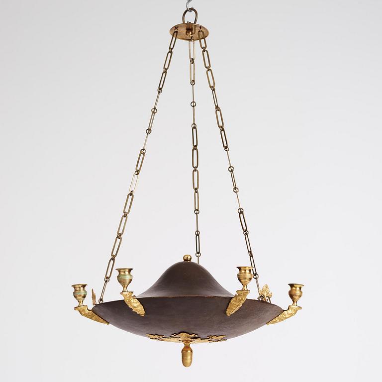 A Swedish Empire ormolu and tole six-branch chandelier, Stockholm, early 19th century.