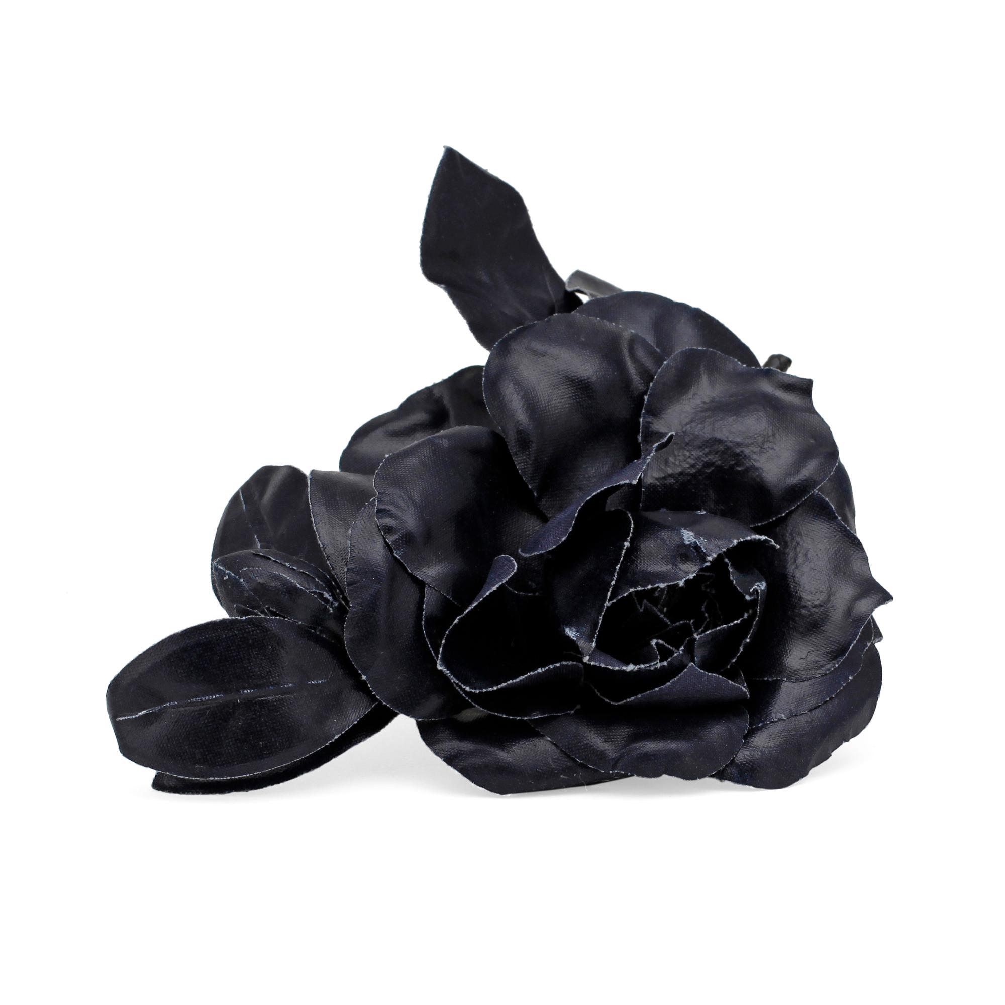 YVES SAINT LAURENT, a dark blue brooch.