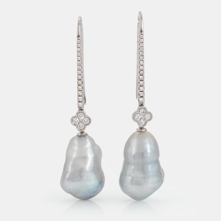 A pair of cultured South Sea pearl earrings in 18K white gold set with round brilliant-cut diamonds.