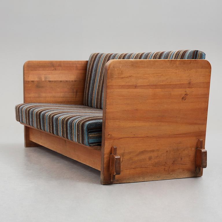 Axel Einar Hjorth, a stained pine "Lovö" sofa, Nordiska Kompaniet, Sweden 1930's.