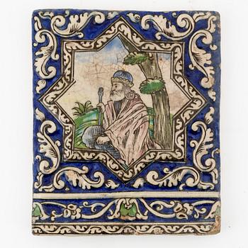 A Persian (Iranian) tile, glazed pottery, Qajar dynasty, 19th century.