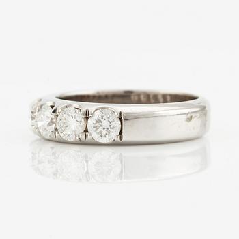 Ring with five brilliant-cut diamonds.