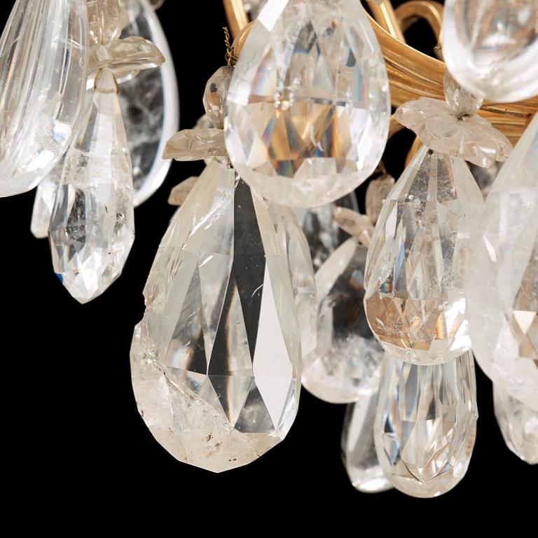 A late Baroque-style rock crystal twelve-light chandelier, circa 1900.