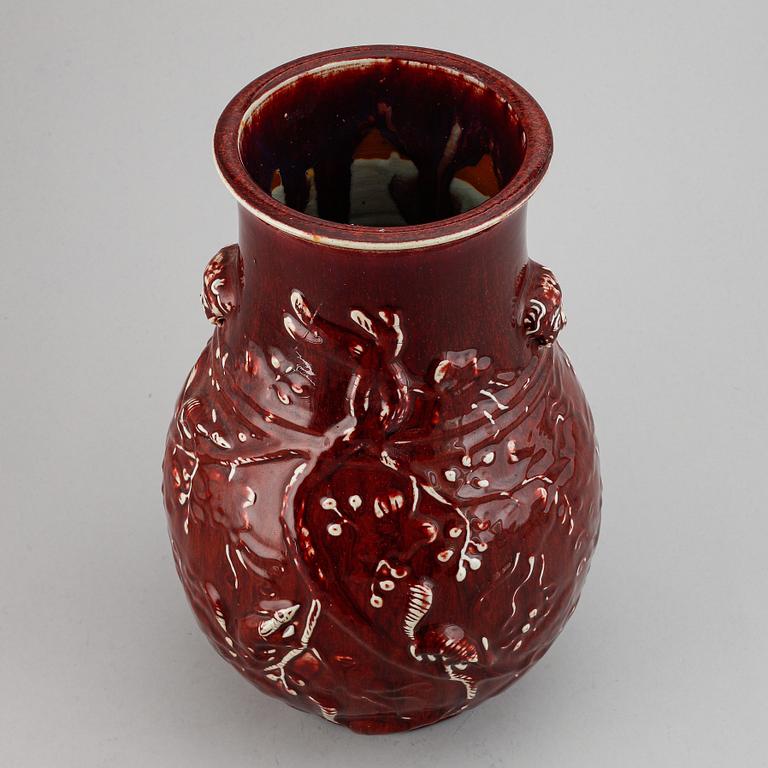 A red glazed Chinese vase, 20th century.