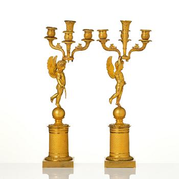 A pair of Empire ormula candelabras.