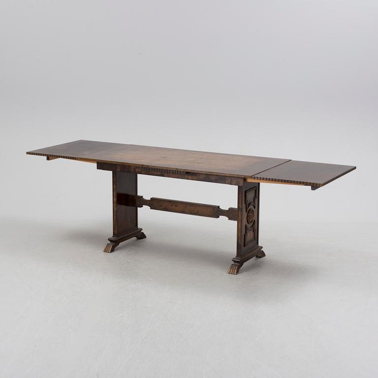 A 1920´s dinner table and six chairs probably designed by Axel Einar Hjorth for AB Svenska möbelfabriken Bodafors.