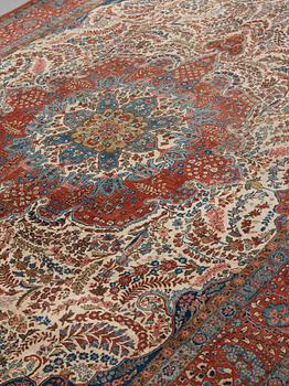 A carpet, a semi-antique Qum, ca 380,5-387,5 x 250,5-259,5 cm.