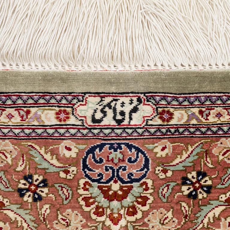 A oriental silk rug, c. 148 x 100 cm.