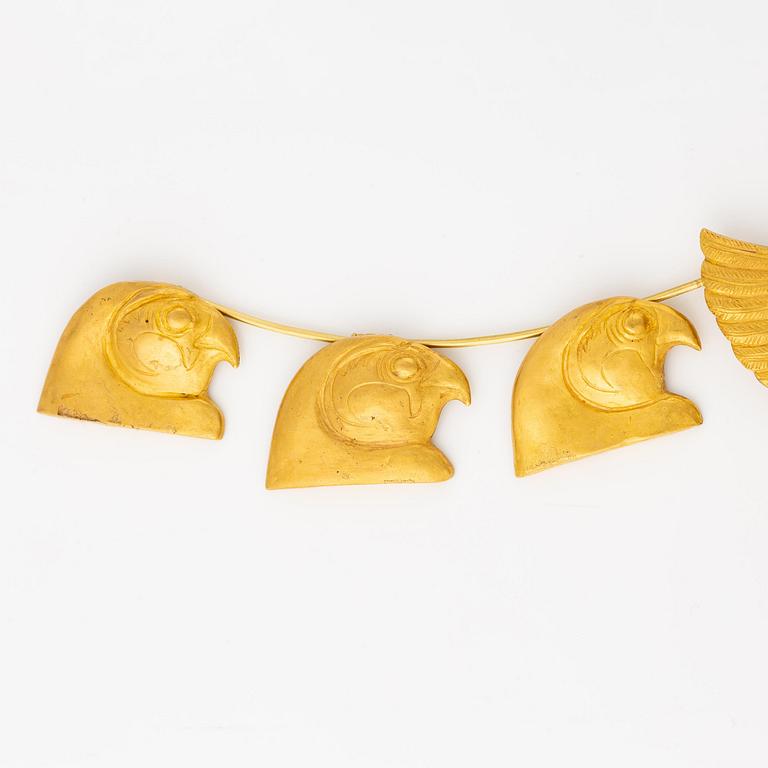 A modern Egyptian-style gold necklace.