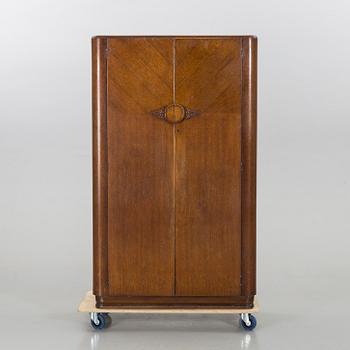 An English Lebus Furniture mens wardrobe around 1900.